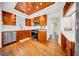 Bright kitchen with stainless steel appliances, wood cabinets and a copper ceiling at 150 23Rd N Ave, St Petersburg, FL 33704