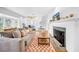 Bright and open living room featuring hardwood floors, fireplace, and large sofa at 150 23Rd N Ave, St Petersburg, FL 33704