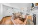 Inviting living room featuring hardwood floors, a fireplace, and large windows at 150 23Rd N Ave, St Petersburg, FL 33704