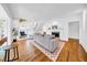 Spacious living room with fireplace, hardwood floors, and comfortable seating perfect for relaxation and gatherings at 150 23Rd N Ave, St Petersburg, FL 33704