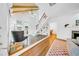 Bright living room with hardwood floors, built-in bookshelves, and a staircase at 150 23Rd N Ave, St Petersburg, FL 33704
