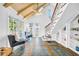 Sunny sitting area with hardwood floors, large windows, and a staircase at 150 23Rd N Ave, St Petersburg, FL 33704