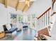 Bright sitting area with hardwood floors, large windows, and comfortable seating at 150 23Rd N Ave, St Petersburg, FL 33704