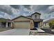 Charming two-story home with a two-car garage and neutral-toned facade at 15411 Quail Woods Pl, Ruskin, FL 33573
