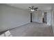 Expansive main bedroom with neutral carpet and a ceiling fan at 15411 Quail Woods Pl, Ruskin, FL 33573