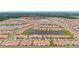 An aerial view of a large community showcasing organized streets, houses, and many ponds at 17228 Holly Well Ave, Wimauma, FL 33598