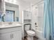 Bathroom featuring tub and shower combination, storage cabinet, and vanity at 17228 Holly Well Ave, Wimauma, FL 33598