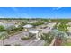 Community entrance with guard house and well-maintained landscaping at the entry of the neighborhood at 17228 Holly Well Ave, Wimauma, FL 33598