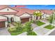 Charming home features a well-manicured lawn, tile roof, and paved driveways at 17228 Holly Well Ave, Wimauma, FL 33598