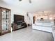 Open-concept living room showing the kitchen, dining area, and staircase at 17228 Holly Well Ave, Wimauma, FL 33598