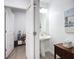 Clean powder room featuring modern fixtures, vanity with pedestal sink and tile flooring at 17228 Holly Well Ave, Wimauma, FL 33598