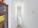 Bright stairway features white walls, handrail, and access to lower level at 17228 Holly Well Ave, Wimauma, FL 33598