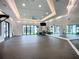 Spacious studio with mirrors, fitness equipment, and natural lighting at 17228 Holly Well Ave, Wimauma, FL 33598