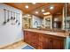 Bathroom features a granite countertop vanity, dual sinks, and a large, decorative mirror at 17301 Estes Rd, Lutz, FL 33548