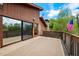 Spacious wooden deck overlooking the serene landscape and featuring an American flag at 17301 Estes Rd, Lutz, FL 33548