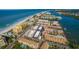 Stunning aerial view of a coastal community, showcasing beachfront access and serene waterfront living at 19700 Gulf Blvd # 403, Indian Shores, FL 33785