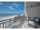 Enjoy stunning beach and ocean views from this lovely balcony with seating at 19700 Gulf Blvd # 403, Indian Shores, FL 33785