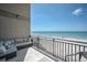 Balcony overlooking pristine beach, offering breathtaking ocean views and comfortable seating at 19700 Gulf Blvd # 403, Indian Shores, FL 33785
