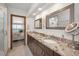 Bathroom features double sinks, granite countertops, framed mirrors, with access to the bedroom showcasing ocean views at 19700 Gulf Blvd # 403, Indian Shores, FL 33785