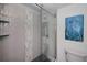 Modern bathroom features a glass enclosed shower with decorative tile and built-in shelving at 19700 Gulf Blvd # 403, Indian Shores, FL 33785