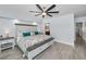 Bright bedroom with a decorative ceiling fan, stylish wood-look floors, and a beautifully decorated king size bed at 19700 Gulf Blvd # 403, Indian Shores, FL 33785