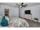 Comfortable bedroom with a ceiling fan, dresser, and calming blue walls at 19700 Gulf Blvd # 403, Indian Shores, FL 33785