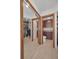 Walk-in closet with custom shelving, mirrored door and features a connected powder room at 19700 Gulf Blvd # 403, Indian Shores, FL 33785