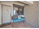 Inviting entryway with a bench, decorative pillow, and textured wall with a window to the outside at 19700 Gulf Blvd # 403, Indian Shores, FL 33785