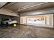 Spacious garage featuring an automatic roll up door for a car or truck at 19700 Gulf Blvd # 403, Indian Shores, FL 33785