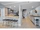 Hallway featuring a modern kitchen, a spiral staircase, and stylish coastal decor at 19700 Gulf Blvd # 403, Indian Shores, FL 33785