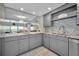Bright, updated kitchen with grey cabinets, stainless appliances and beautiful water view at 19700 Gulf Blvd # 403, Indian Shores, FL 33785