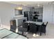 Open-concept kitchen and dining area features modern appliances and neutral color palette at 19700 Gulf Blvd # 403, Indian Shores, FL 33785