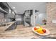 Modern kitchen with stainless steel appliances, granite countertops, and a spiral staircase nearby at 19700 Gulf Blvd # 403, Indian Shores, FL 33785