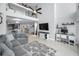 Spacious living room with a high ceiling, comfortable seating, and easy access to the kitchen and dining area at 19700 Gulf Blvd # 403, Indian Shores, FL 33785