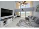 Bright living room with floor-to-ceiling windows offering stunning ocean views and a comfortable seating area at 19700 Gulf Blvd # 403, Indian Shores, FL 33785