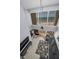 Spacious living room with water views, comfortable seating, and a stylish ceiling fan at 19700 Gulf Blvd # 403, Indian Shores, FL 33785