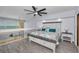 Light and airy main bedroom features a beach view, stylish furniture, and wood-look flooring at 19700 Gulf Blvd # 403, Indian Shores, FL 33785