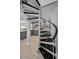 Unique spiral staircase is carpeted, and provides easy access to the kitchen and other areas of the home at 19700 Gulf Blvd # 403, Indian Shores, FL 33785