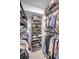 Spacious walk-in closet with custom shelving and plenty of room for shoes and clothing at 19700 Gulf Blvd # 403, Indian Shores, FL 33785