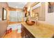 Bathroom with a vanity and large mirror and a tub-shower combo at 20 Willowwood Ln, Oldsmar, FL 34677