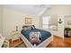Cozy bedroom with a window, bedside table, and nautical-themed décor at 20 Willowwood Ln, Oldsmar, FL 34677