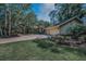 Sprawling single Gathering home featuring lush landscaping, brick driveway, and a 2-car garage at 20 Willowwood Ln, Oldsmar, FL 34677