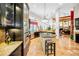 Spacious kitchen with stainless steel appliances, center island, and breakfast bar at 20 Willowwood Ln, Oldsmar, FL 34677