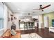 Spacious living room with a bar area, dark hardwood floors, and modern furnishings at 2001 E Idlewild Ave, Tampa, FL 33610