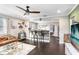 Open-concept living space with hardwood floors seamlessly connecting to the kitchen and dining area at 2001 E Idlewild Ave, Tampa, FL 33610