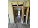 Hallway with new flooring leading to back of home, offering a clear perspective of layout, potential for improvement at 204 162Nd Ave, Redington Beach, FL 33708