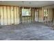 Partially renovated living room with modern flooring, exposed wall studs, and natural light at 204 162Nd Ave, Redington Beach, FL 33708