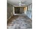 Expansive living room with sleek new flooring, ready to be transformed into a cozy and inviting space at 204 162Nd Ave, Redington Beach, FL 33708