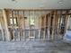 Spacious living room with modern flooring and exposed wall studs ready for customization at 204 162Nd Ave, Redington Beach, FL 33708