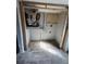 Utility room featuring modern tile flooring, exposed framing, and plumbing for new appliances installation at 204 162Nd Ave, Redington Beach, FL 33708